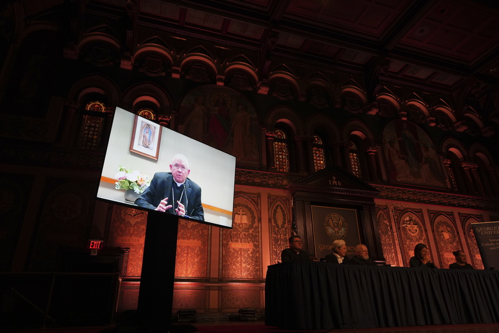 The archbishop of Los Angeles, José Gomez, speaks to a crowd at Georgetown University via livestream about the effects of the Trump administration's crackdown on immigrants during a panel in Washington, Thursday, Sept. 11, 2025. (AP Photo/Luis Andres Henao)