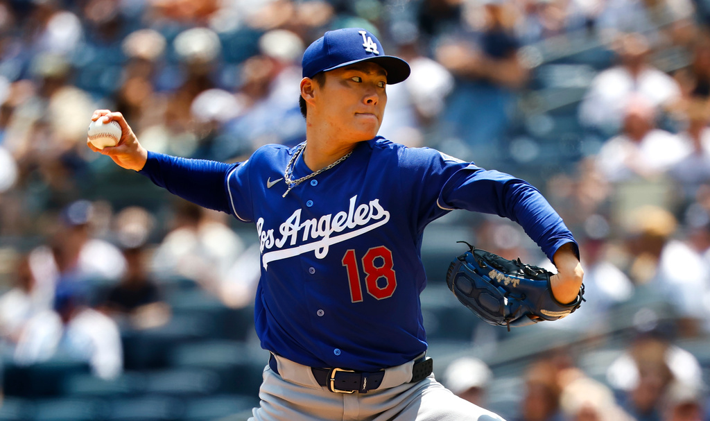 Los Angeles Dodgers' Yoshinobu Yamamoto delivers during the first inning of the first game of a baseball doubleheader against the New York Yankees, Sunday, July 19, 2026, in New York. (AP Photo/Noah K. Murray)