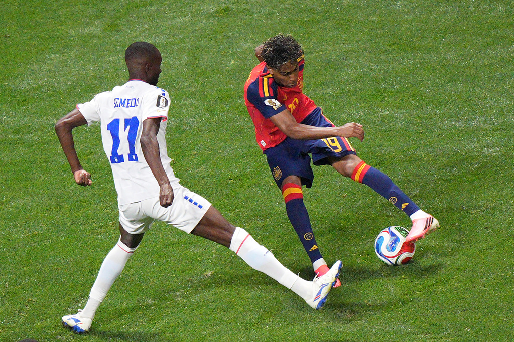Spain's Lamine Yamal (19) controls the ball against Cape Verde's Willy Semedo (17) during the World Cup Group H soccer match between Spain and Cape Verde in Atlanta, Monday, June 15, 2026. (AP Photo/Jacob Kupferman)