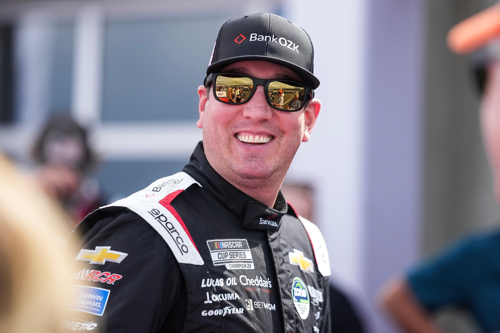 FILE - Kyle Busch smiles prior to a NASCAR Cup Series auto race at Charlotte Motor Speedway, Sunday, Oct. 5, 2025, in Concord, N.C. (AP Photo/Matt Kelley, File)