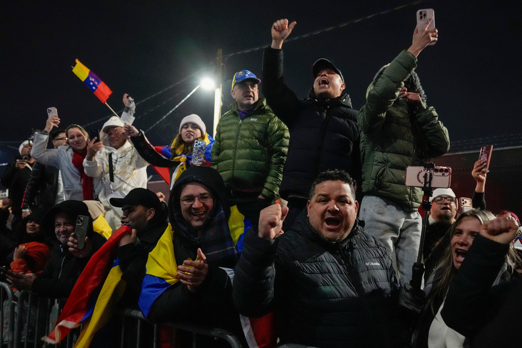 Demonstrators celebrate the arrival of captured Venezuelan President Nicolas Maduro at the Metropolitan Detention Center, Saturday, Jan. 3, 2026, in New York. (AP Photo/Yuki Iwamura)