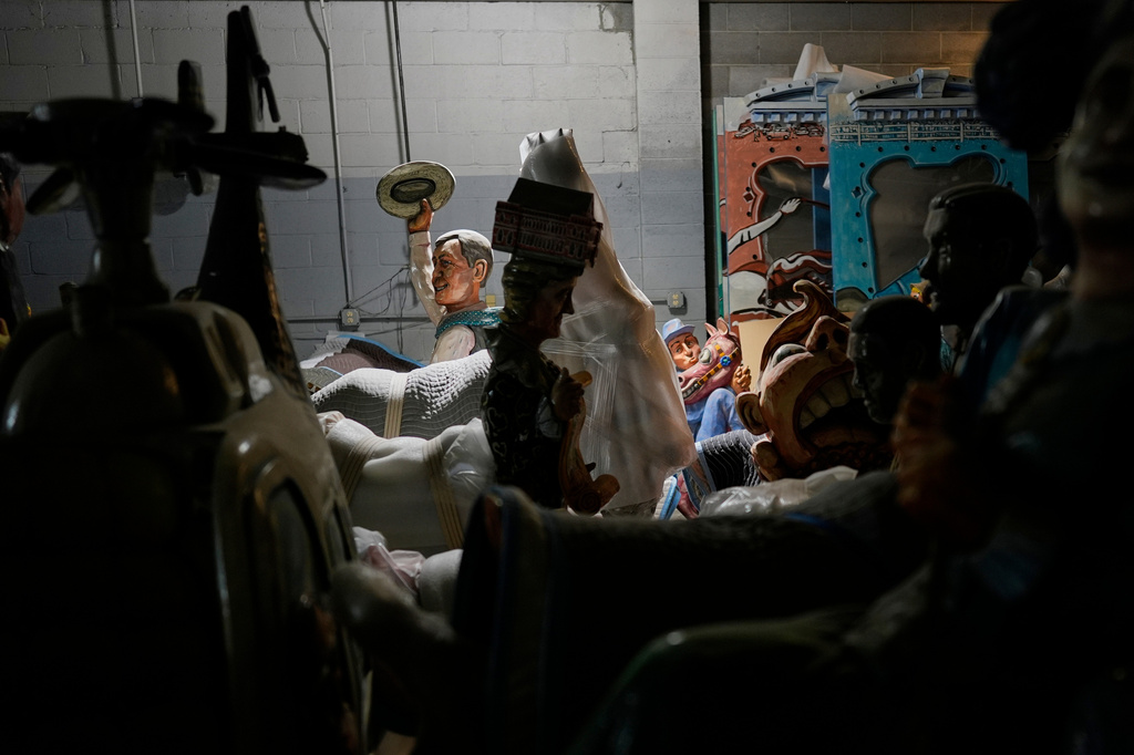 A figure of Chet Atkins and other parts of the Fox Trot Carousel are seen in a state government storage facility Wednesday, June 24, 2026, in Nashville, Tenn. (AP Photo/George Walker IV)