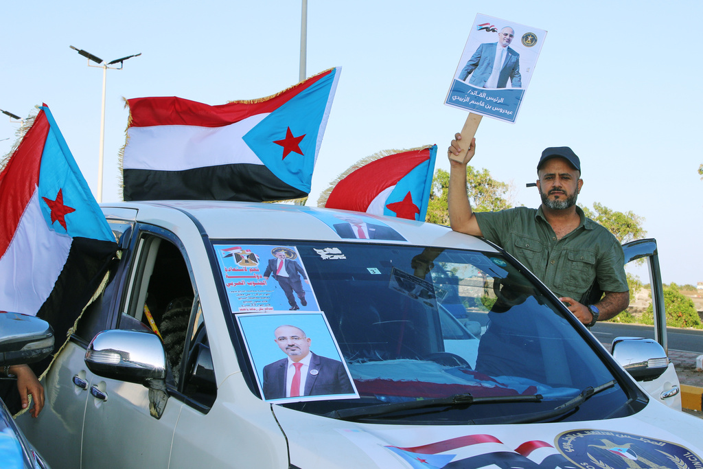 Supporters of the Southern Transitional Council (STC), a coalition of separatist groups seeking to restore the state of South Yemen, hold South Yemen flags and a poster of their leader, Aidarous al-Zubaidi during a rally, in Aden, Yemen, Dec. 25, 2025. (AP Photo)