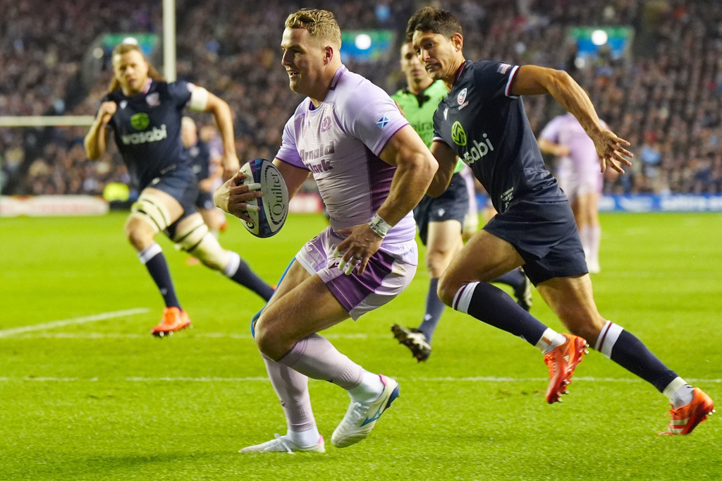 Scotland's Duhan van der Merwe scores his sides second try of the game during the rugby union Series match between Scotland and the USA at in Edinburgh, Saturday, Nov. 4, 2025. (Jane Barlow/PA via AP)