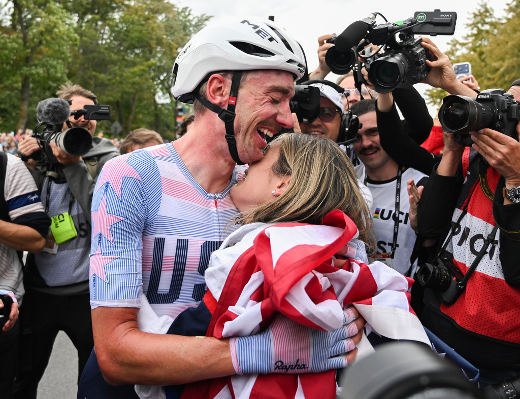 Brandon McNulty, of the United States, is hugged by his wife Summer after winning the men's elite road race at the UCI Road World Championships cycling event in Montreal on Sunday, Sept. 27, 2026. (Graham Hughes/The Canadian Press via AP)