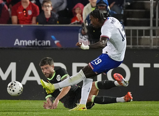 United States forward Haji Wright, front, kicks the ball for a goal as Australia defender Cameron Burgess covers in the second half of an international friendly soccer match Tuesday, Oct. 14, 2025, in Commerce City, Colo.(AP Photo/David Zalubowski) United States forward Haji Wright, front, kicks the ball for a goal as Australia defender Cameron Burgess covers in the second half of an international friendly soccer match Tuesday, Oct. 14, 2025, in Commerce City, Colo.(AP Photo/David Zalubowski)