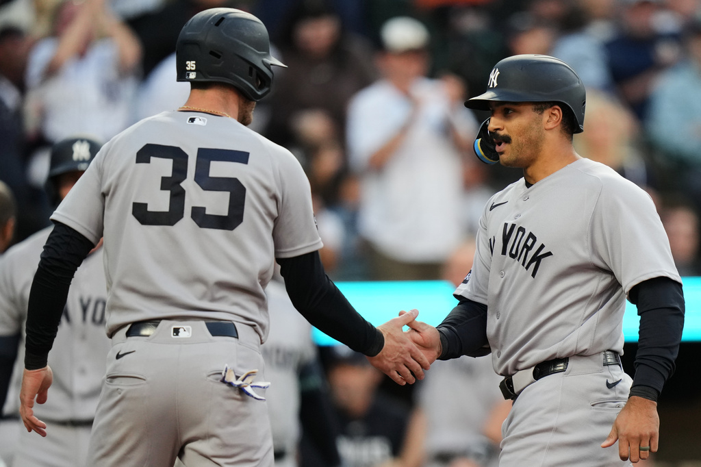 New York Yankees' Trent Grisham, right, celebrates with Cody Bellinger after hitting a three-run home run during the third inning of a baseball game against the Baltimore Orioles, Tuesday, May 12, 2026, in Baltimore. (AP Photo/Stephanie Scarbrough)