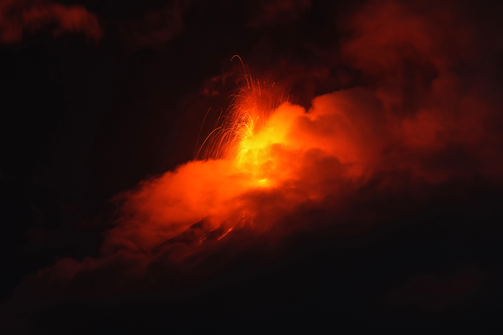 Lava flows out of the crater of the Fuego Volcano, as seen from San Juan Alotenango, Guatemala, Tuesday, Aug. 4, 2026. (AP Photo/Moises Castillo)