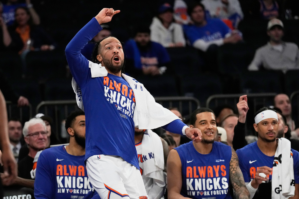 New York Knicks' Jalen Brunson reacts while watching from the bench during the second half of Game 1 in a second-round NBA basketball playoffs series against the Philadelphia 76ers Monday, May 4, 2026, in New York. (AP Photo/Seth Wenig)