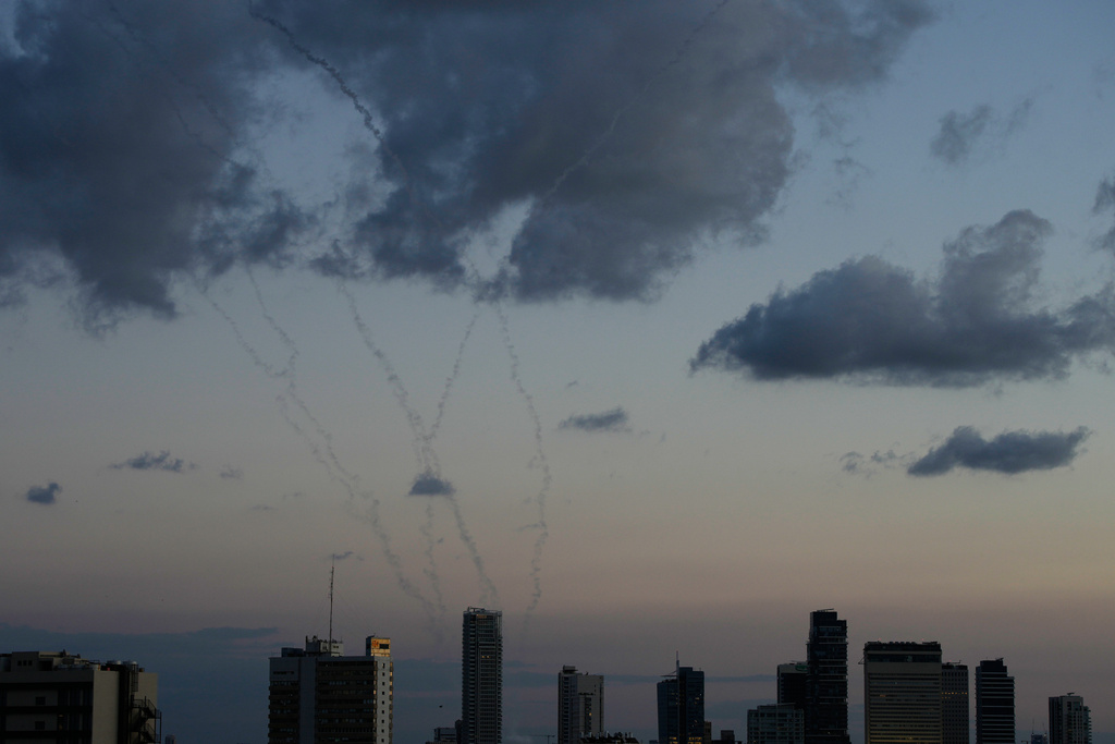Traces of an air defense missile interception is seen over Tel Aviv, Israel, Saturday, Feb. 28, 2026. (AP Photo/Ohad Zwigenberg)