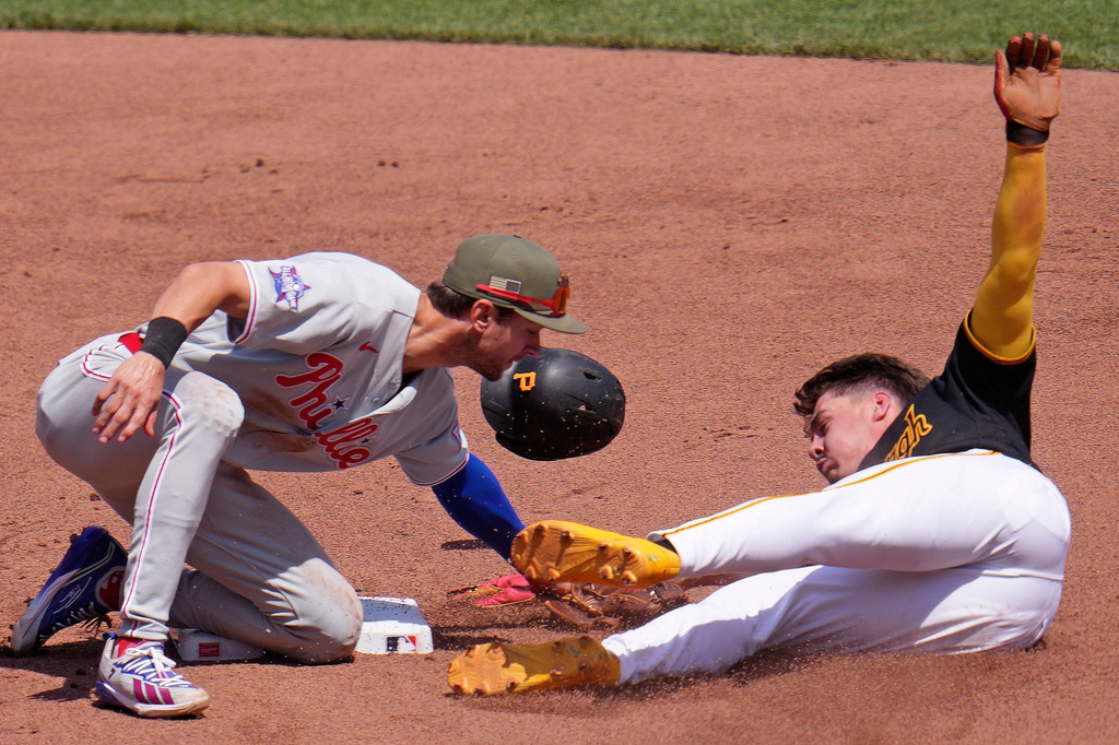 Pittsburgh Pirates' Konnor Griffin, right, is tagged out on a steal-attempt of second base by Philadelphia Phillies shortstop Trea Turner, left, during the fifth inning of a baseball game in Pittsburgh, Sunday, May 17, 2026. (AP Photo/Gene J. Puskar)