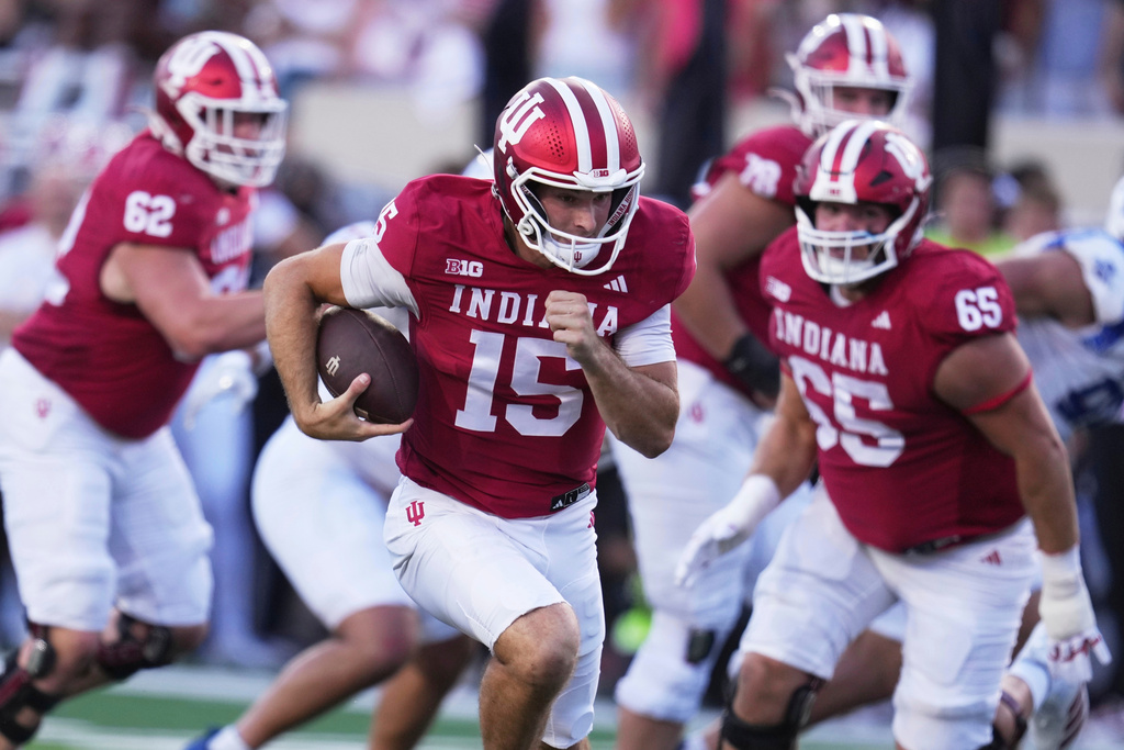 FILE - Indiana quarterback Fernando Mendoza (15) runs during the first half of an NCAA college football game against Indiana State, Friday, Sept. 12, 2025, in Bloomington, Ind. (AP Photo/Darron Cummings, File)