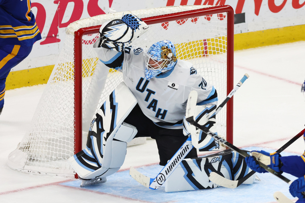 Utah Mammoth goaltender Karel Vejmelka (70) makes a glove save during the overtime period of an NHL hockey game against the Buffalo Sabres Tuesday, Nov. 4, 2025, in Buffalo, N.Y. (AP Photo/Jeffrey T. Barnes)