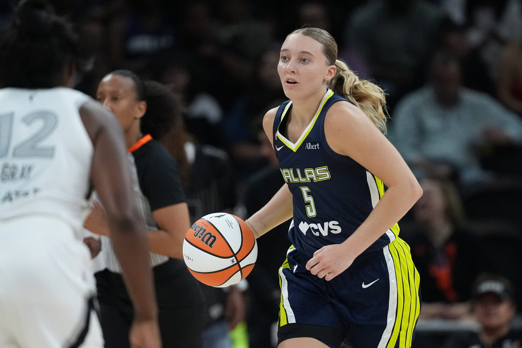 Dallas Wings guard Paige Bueckers (5) moves the ball up court against the Las Vegas Aces during the second half of a WNBA preseason basketball game in Austin, Texas, Sunday, May 3, 2026. (AP Photo/Eric Gay)