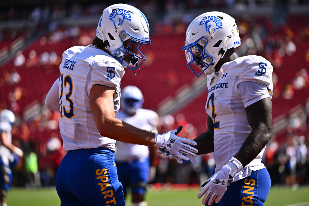 San Jose State wide receiver Cooper Hoch (13) is greeted by wide receiver Jerry McClure, right, after scoring a touchdown during the second half of an NCAA college football game against Southern California, Saturday, Aug. 29, 2026, in Los Angeles. (AP Photo/William Liang)