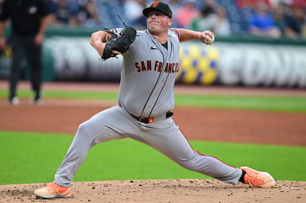 San Francisco Giants starting pitcher Matt Wilkinson delivers during the first inning of a baseball game against the Cleveland Guardians, Wednesday, Aug. 19, 2026, in Cleveland. (AP Photo/David Dermer)