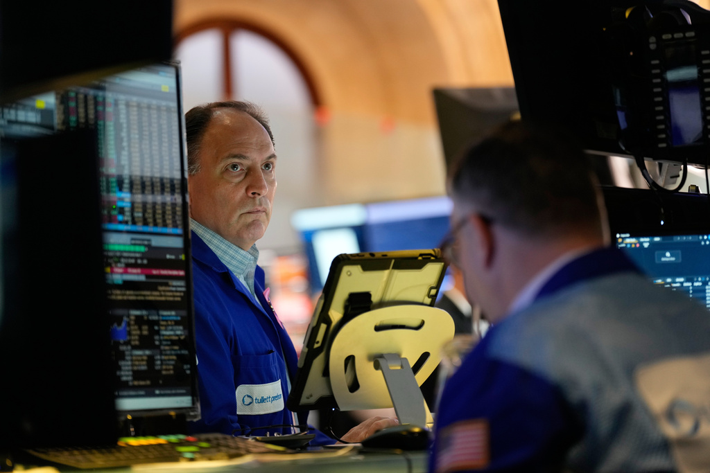 James Conti works on the floor at the New York Stock Exchange in New York, Tuesday, Nov. 11, 2025. (AP Photo/Seth Wenig)