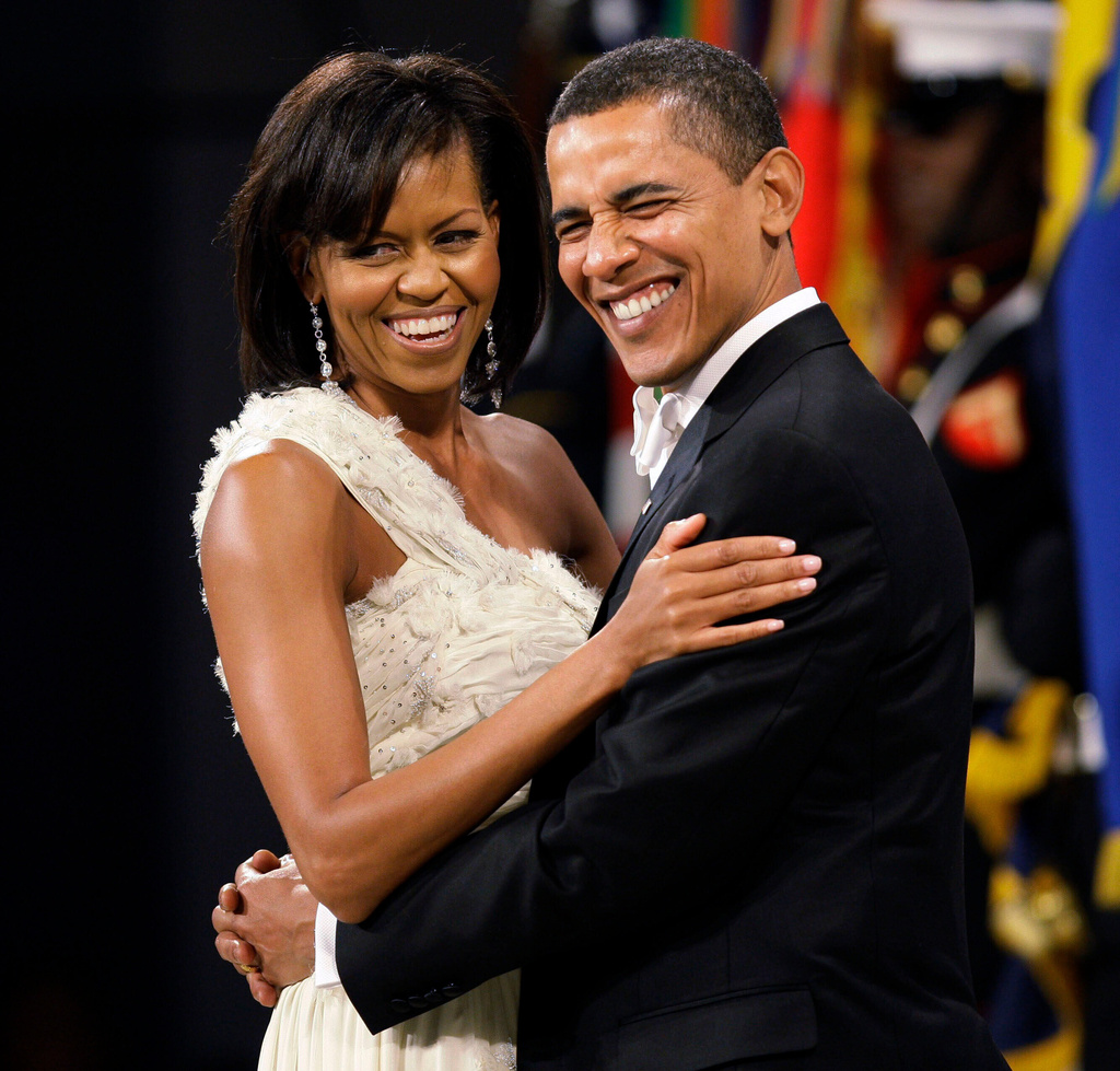 FILE - President Barack Obama and first lady Michelle Obama dance at the Obama Home States Inaugural Ball in Washington, Jan. 20, 2009. (AP Photo/Charlie Neibergall, File)
