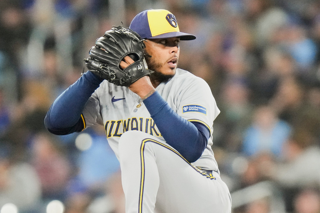 Milwaukee Brewers pitcher Freddy Peralta (51) works against the Toronto Blue Jays during the sixth inning of a baseball game in Toronto on Friday, Aug. 29, 2025. (Chris Young/The Canadian Press via AP)
