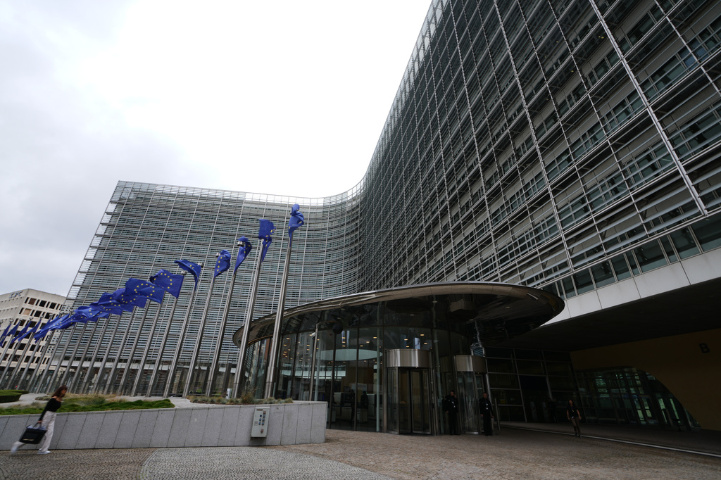 European Union flags flap in the wind outside EU headquarters in Brussels, prior to an announcement regarding Google, Thursday, July 23, 2026. (AP Photo/Virginia Mayo)