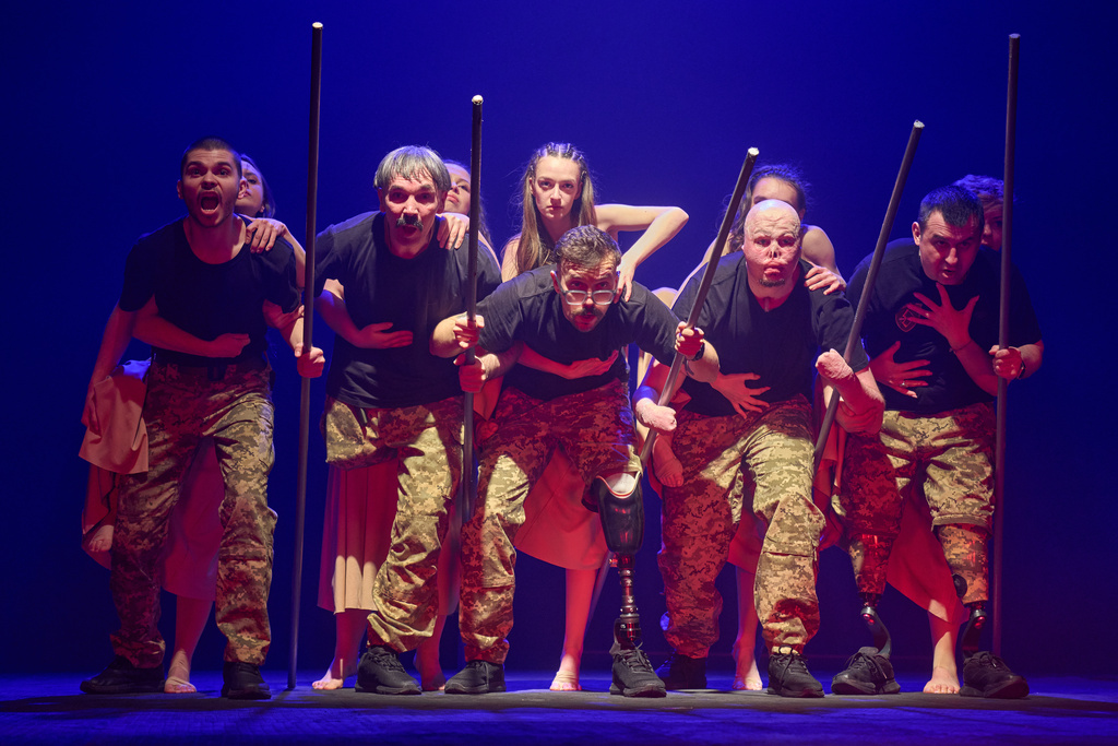 Ukrainian war veterans, many of whom sustained severe injuries in combat during Russia's full-scale invasion of Ukraine, perform during a premiere on Thursday, Feb. 19, 2026, in Kyiv, Ukraine. (AP Photo/Efrem Lukatsky)
