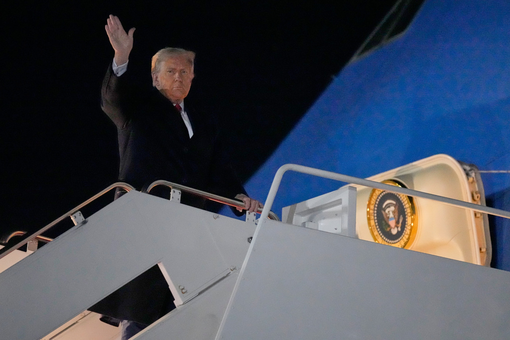 President Donald Trump waves as he boards Air Force One, Friday, Oct. 24, 2025, at Joint Base Andrews, Md., for a trip to Asia. (AP Photo/Mark Schiefelbein)
