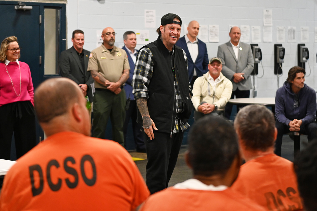 This photo provided by the Nashville-Davidson County Sheriff's Office shows country music star Jelly Roll, whose legal name is Jason DeFord, speaking to inmates at the Davidson County Sheriff’s Office Annex in Nashville, Tenn., Nov. 25, 2025. (Reginald Scott/Nashville-Davidson County Sheriff's Office via AP)