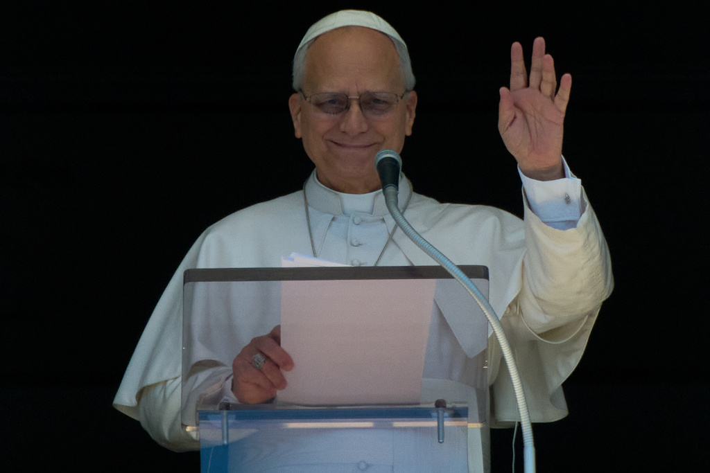 Pope Leo XIV delivers his blessing as he recites the Regina Coeli noon prayer from the window of his studio overlooking St.Peter's Square, at the Vatican, Monday, April 6, 2026. (AP Photo/Andrew Medichini)