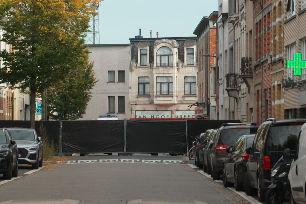 In this image taken from video provided by VTM a black police cordon is set up in a street during an investigation in Antwerp, Belgium, Thursday, Oct. 9, 2025. (VTM via AP)
