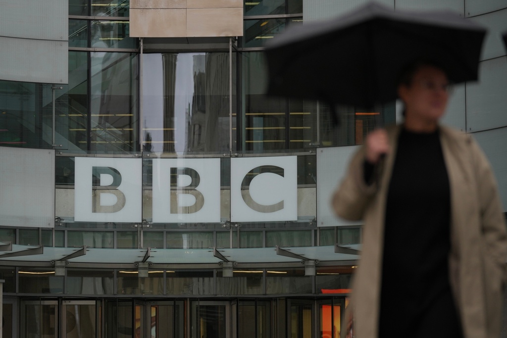 A man walks outside the BBC Headquarters in London, Monday, Nov. 10, 2025. (AP Photo/Kin Cheung)