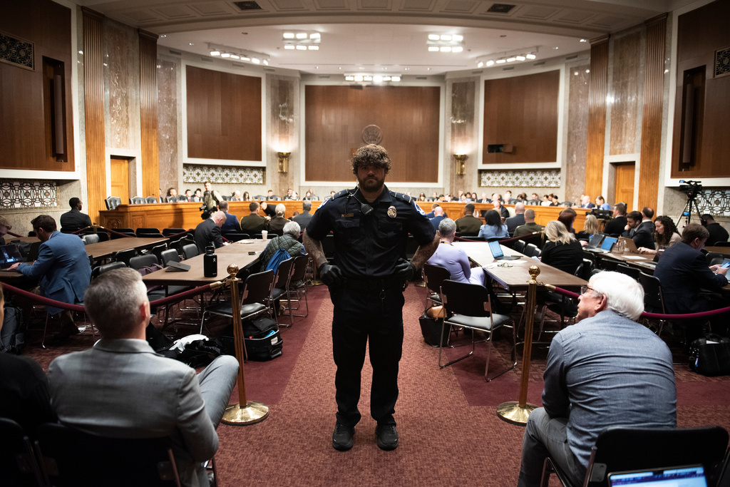 A U.S. Capitol Police officer stands guard as the Senate Armed Services Committee holds a hearing on the Department of Defense budget, on Capitol Hill, in Washington, Thursday, April 30, 2026. (AP Photo/Cliff Owen)
