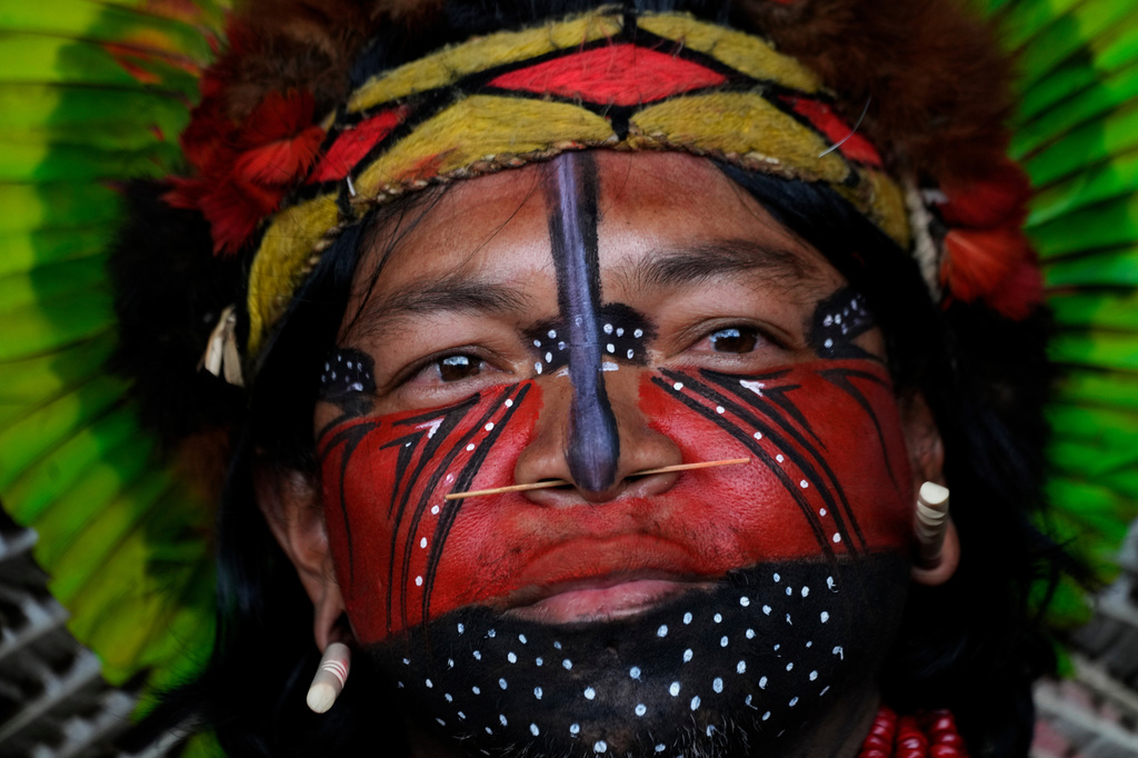 A Pataxo man looks on before a march at the Acampamento Terra Livre 2026, an Indigenous mobilization focused on land rights and environmental protection, in Brasilia, Brazil, Thursday, April 9, 2026. (AP Photo/Eraldo Peres)