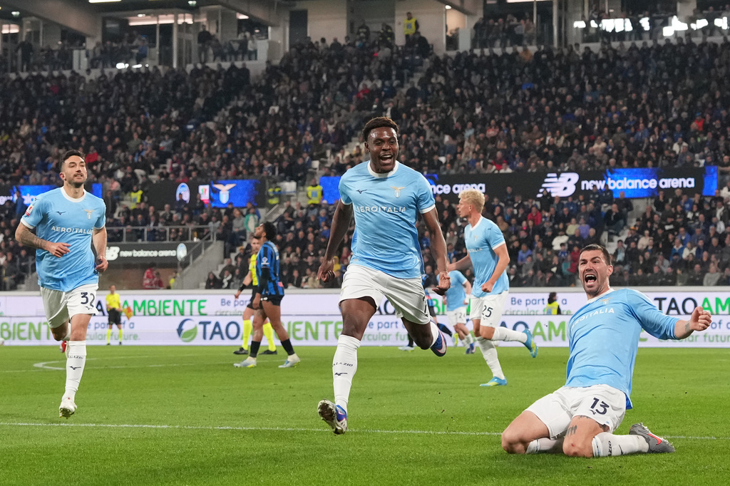 Lazio's Alessio Romagnoli, right, celebrates after scoring during the Italian Cup soccer match between Atalanta and Lazio, Wednesday, April 22 , 2026, in Bergamo, Italy. (Spada/LaPresse via AP)