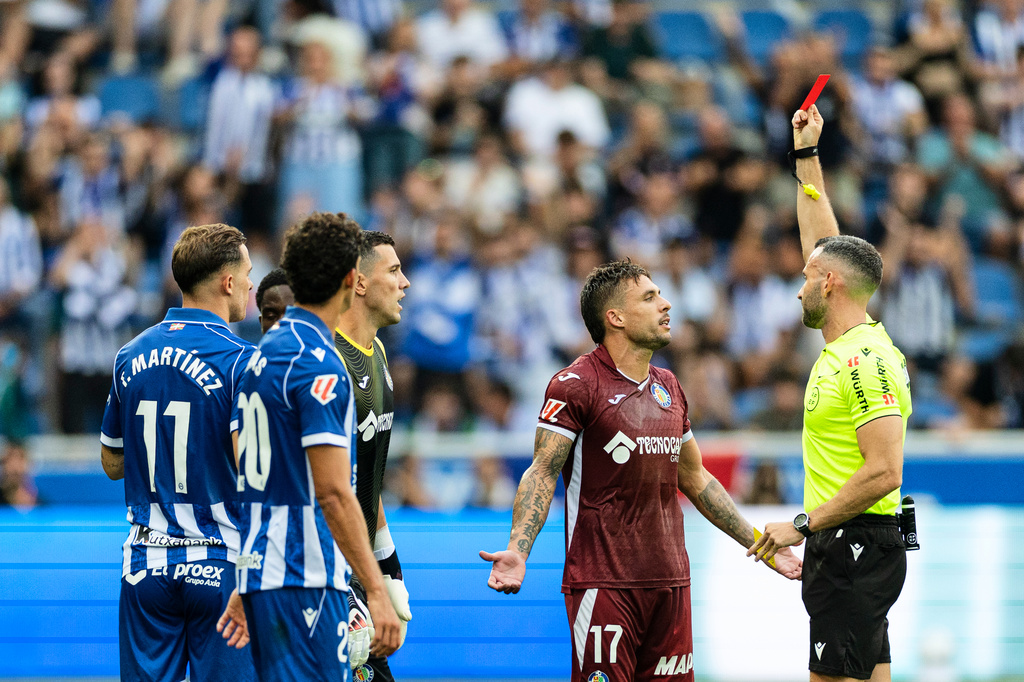 Getafe player Kiko Femenia receives a red card during a Spanish La Liga soccer match against Deportivo Alavés at Mendizorrotza Stadium in Vitoria, Spain, Saturday, Aug. 15, 2026. (AP Photo/Pablo Garcia)