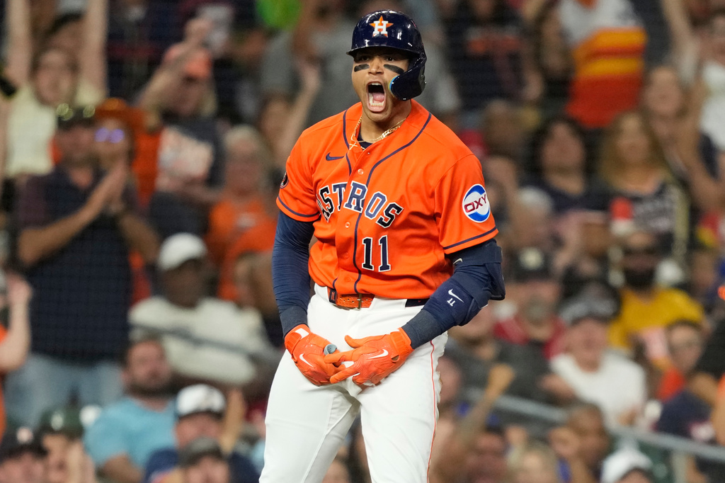Houston Astros' Cam Smith celebrates after hitting a triple against the Texas Rangers during the fourth inning of a baseball game Friday, July 31, 2026, in Houston. (AP Photo/David J. Phillip)