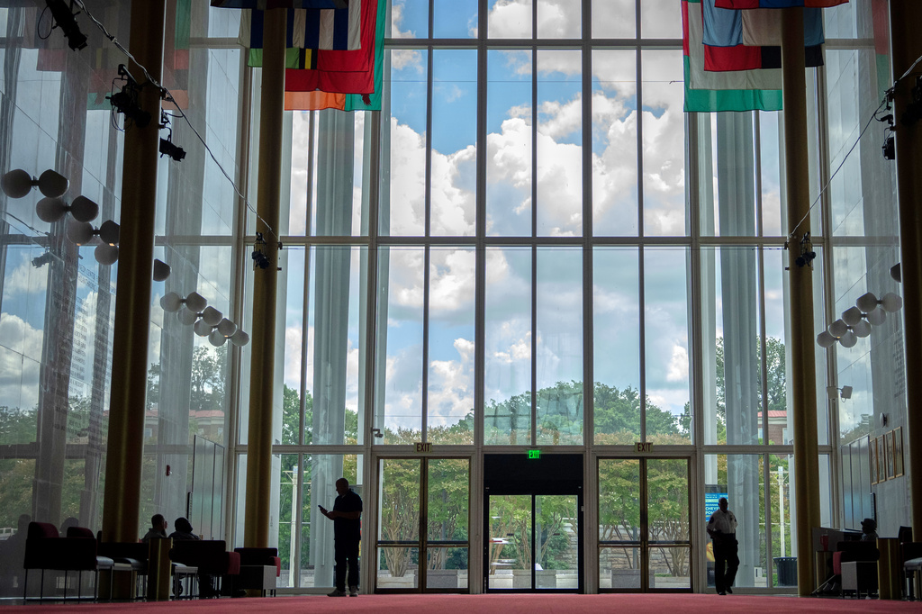 Workers stand inside the Hall of Nations in the Kennedy Center, Friday, July 31, 2026, in Washington. (AP Photo/Mark Schiefelbein)