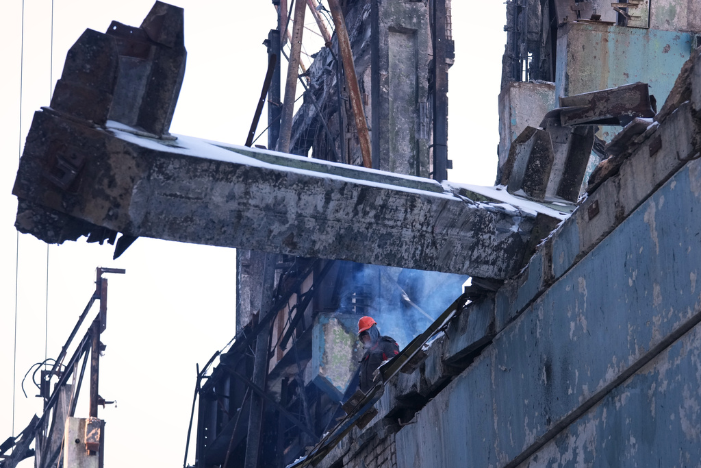 Workers repair the DTEK company's power plant destroyed by a Russian missile attack, at an undisclosed location in Ukraine, Monday, Feb. 9, 2026. (AP Photo/Sergei Grits)