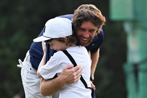 Tommy Fleetwood of England hugs his son Frankie after wining the DP World Tour Championship golf tournament in New Delhi, India, Sunday, Oct.19, 2025. (AP Photo/Dharam Diwakar) Tommy Fleetwood of England hugs his son Frankie after wining the DP World Tour Championship golf tournament in New Delhi, India, Sunday, Oct.19, 2025. (AP Photo/Dharam Diwakar)