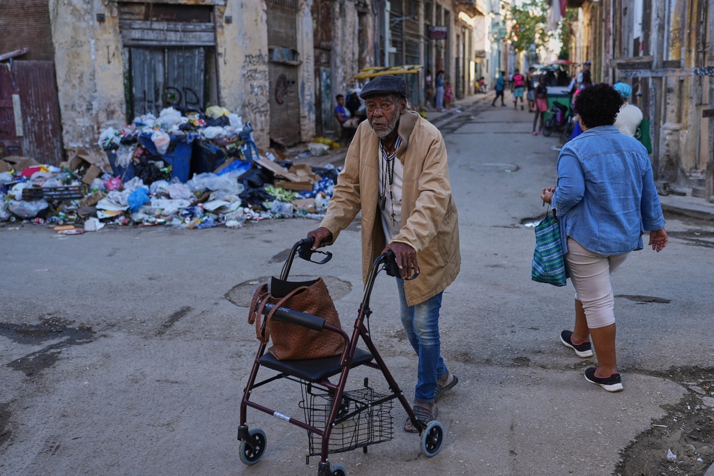 A man traverses a street in Old Havana, Monday, January 5, 2026. (AP Photo/Ramon Espinosa)