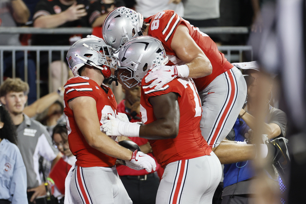 Ohio State tight end Max Klare, left, celebrates his touchdown with teammates against Ohio during the first half of an NCAA college football game, Saturday, Sept. 13, 2025, in Columbus, Ohio. (AP Photo/Jay LaPrete)