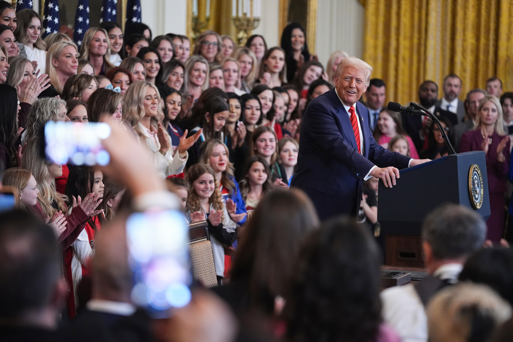 FILE - Women and girls listen to President Donald Trump speak before he signs an executive order barring transgender female athletes from competing in women's or girls' sporting events, in the East Room of the White House, Feb. 5, 2025, in Washington. (AP Photo/ Evan Vucci, File)