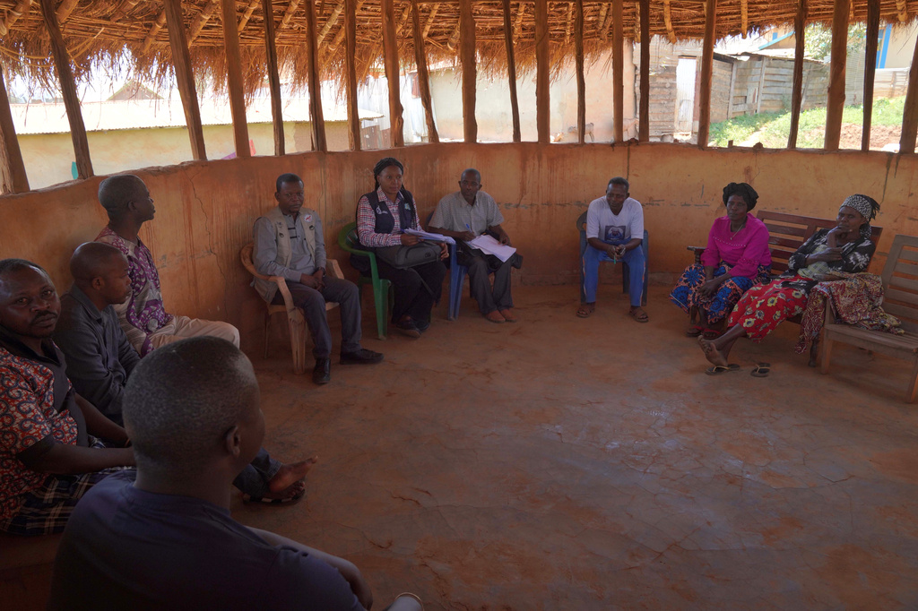 Ana Ndroy Kasime, a community health worker ,second from left, meets other health workers during an Ebola contact tracing in Nizi, Ituri province, eastern Congo, Friday, Aug. 14, 2026. (AP Photo/Dieudonne Dirole)