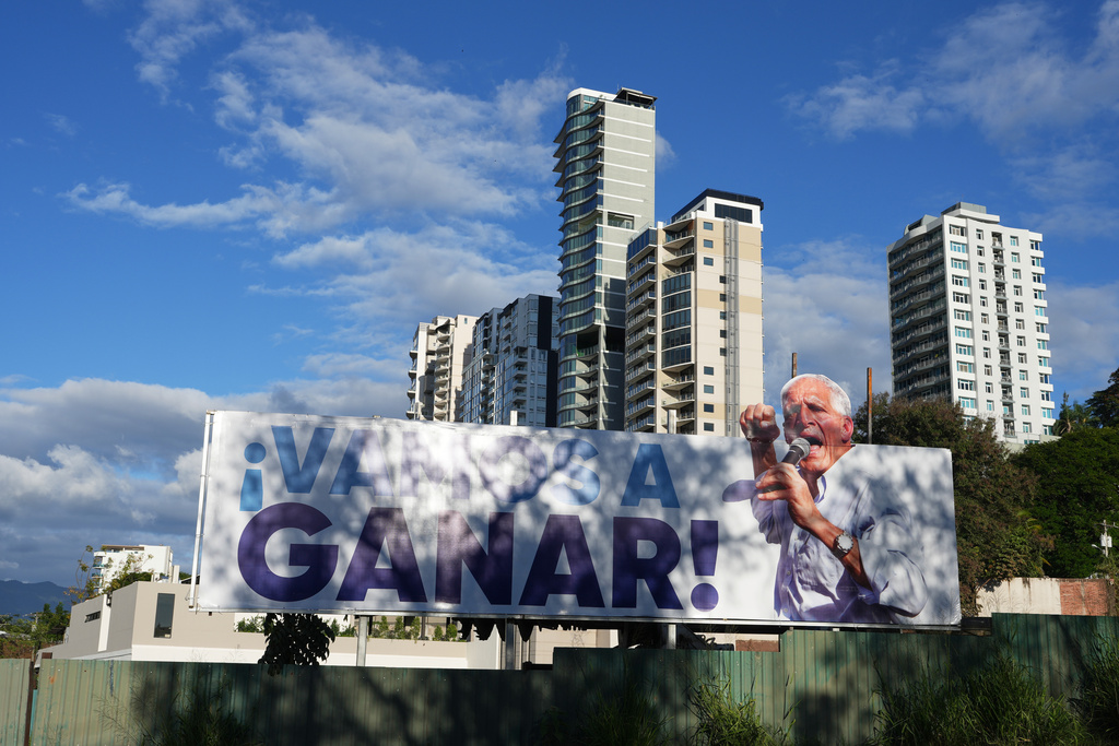 A billboard promoting presidential candidate Nasry Asfura of the National Party stands in Tegucigalpa, Honduras, Friday, Nov. 28, 2025 ahead of Sunday's general election. (AP Photo/Moises Castillo)