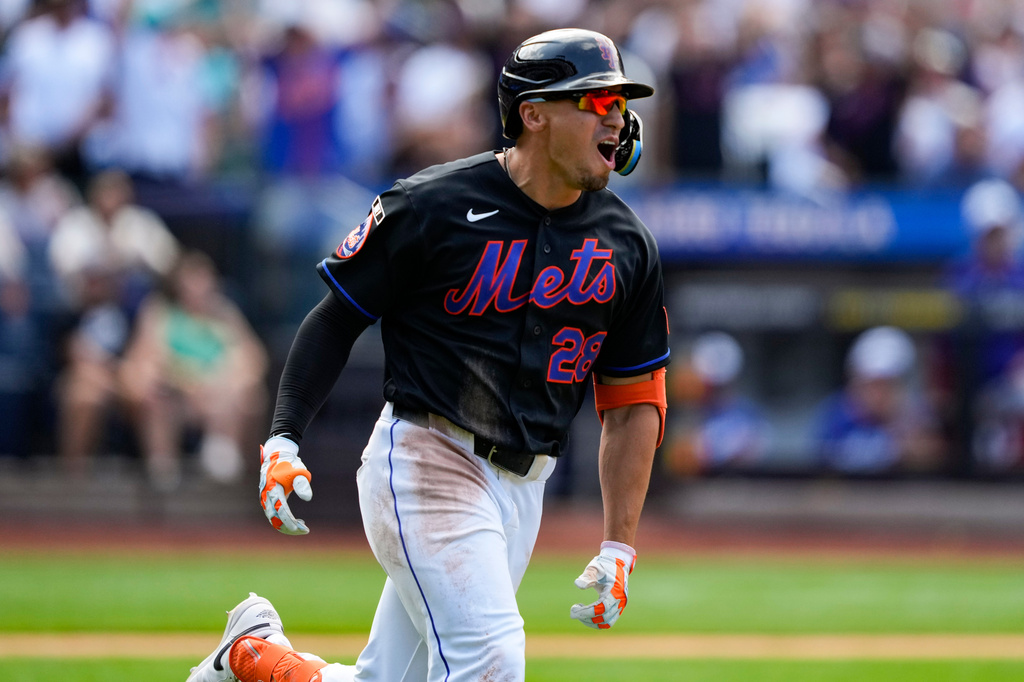 New York Mets' Tyrone Taylor reacts after hitting a three-run home run during the sixth inning of a baseball game against the Los Angeles Dodgers, Sunday, July 26, 2026, in New York. (AP Photo/Yuki Iwamura)
