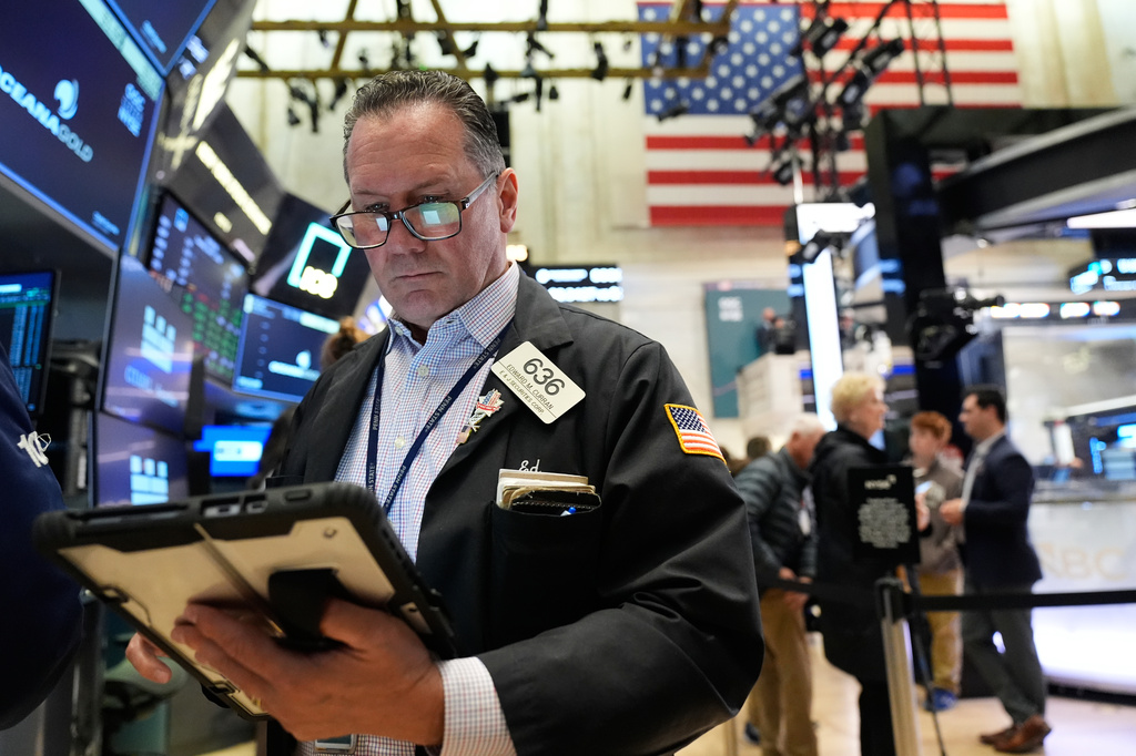 Ed Curran works on the floor at the New York Stock Exchange in New York, Tuesday, April 7, 2026. (AP Photo/Seth Wenig)
