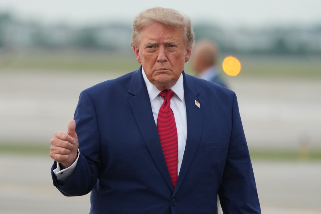 President Donald Trump walks from Marine One to board Air Force One at Cleveland Hopkins International Airport in Cleveland, Tuesday, Aug. 11, 2026. (AP Photo/Mark Schiefelbein)