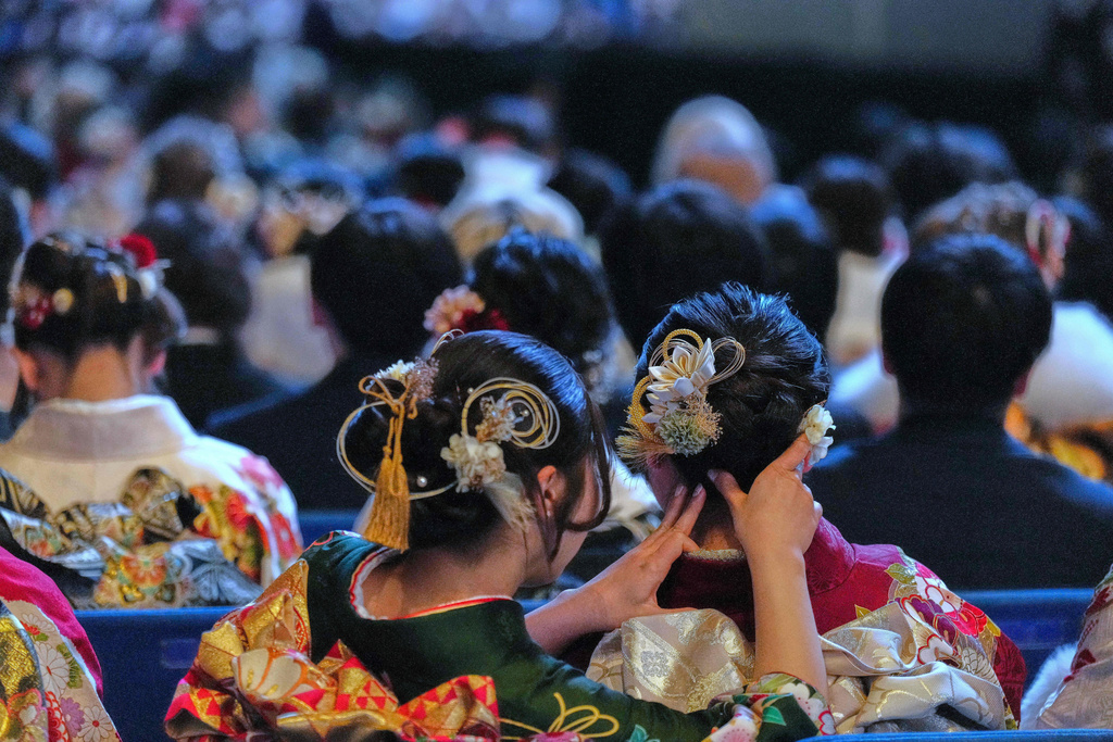 Young adults attend the ceremony to celebrate the Coming-of-Age Day, a centuries-old tradition and national holiday marking the milestone from childhood to adulthood, Monday, Jan. 12, 2026, in Yokohama near Tokyo. (AP Photo/Eugene Hoshiko).