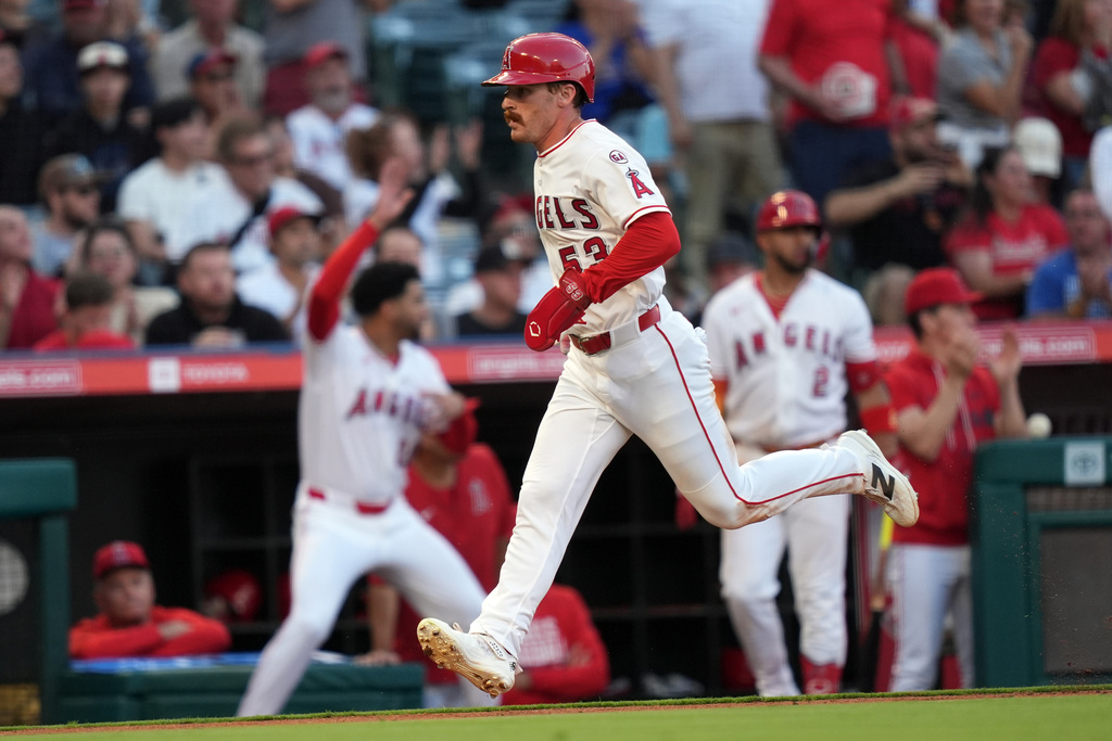 Los Angeles Angels Wade Meckler (53) scores on Jo Adell's two-run double against the Houston Astros during the second inning of a baseball game Tuesday, June 9, 2026, in Anaheim, Calif. (AP Photo/Scott Strazzante)