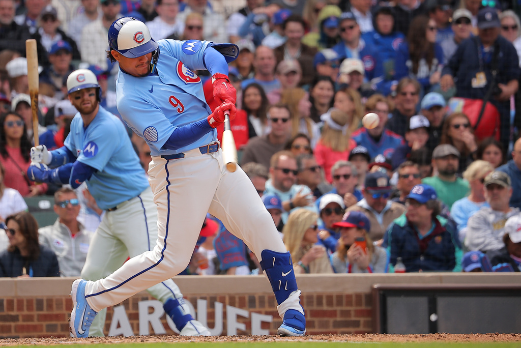 Chicago Cubs' Miguel Amaya singles during the sixth inning of a baseball game against the Houston Astros on Friday, May 22, 2026, in Chicago. (AP Photo/Melissa Tamez)