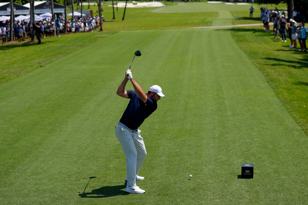Scottie Scheffler hits from the fifth tee during the first round of the Cadillac Championship PGA golf tournament Thursday, April 30, 2026, in Doral, Fla. (AP Photo/David J. Phillip)